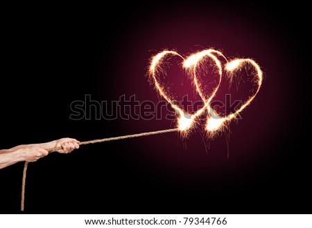 Sparkling Love Heart pulls a pair of hands at the rope.