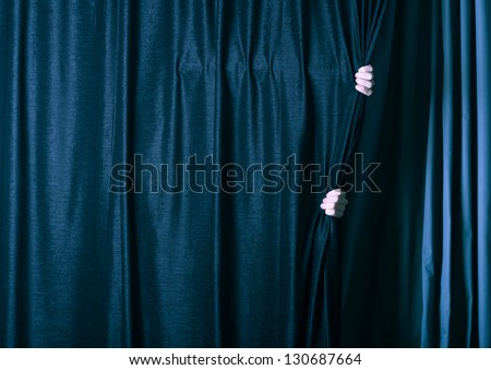 man behind the dark curtain.