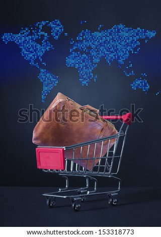 Bag in the shopping cart against the background of the map.