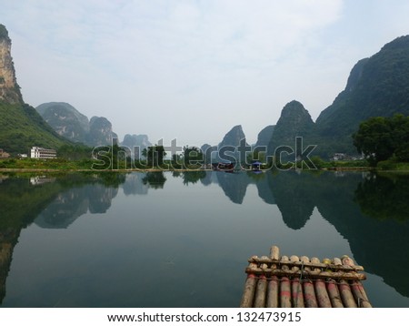 Reflection, bamboo rafting down Li River, Yangshuo, China