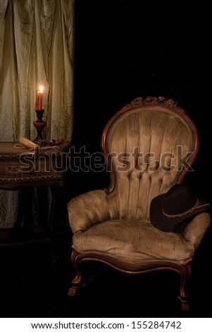 Vintage Western scene with candle, gun, powder horn, and an antique chair with a cowboy hat on it against a black background