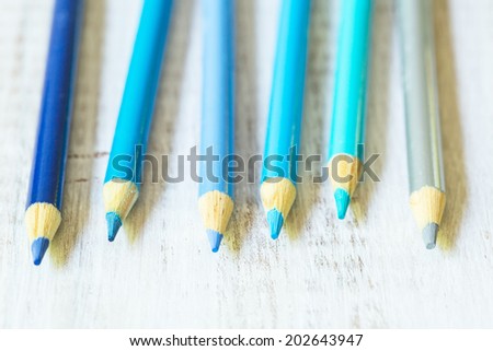 Pastel cool blue color pencils on white close up