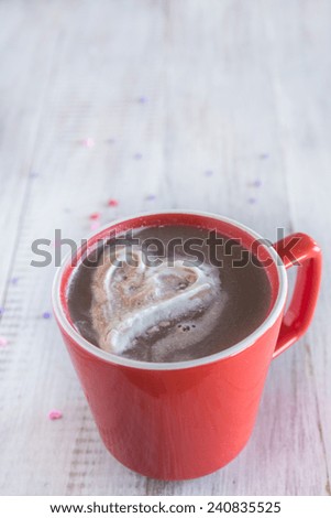 Winter warm hot chocolate drink with whipped cream heart