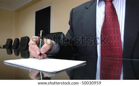 Business Manager writing on blank paper, business concept