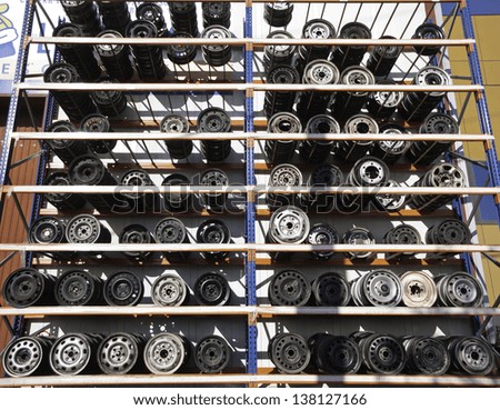 Mechanical workshop with shelving rims and wheels on the outside, industrial building