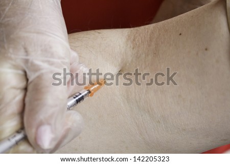 Vein puncture with sterile needle and medication, medicine and nurse