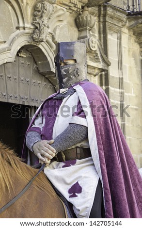 Medieval Roman soldier on horse with old uniform, celebration and event