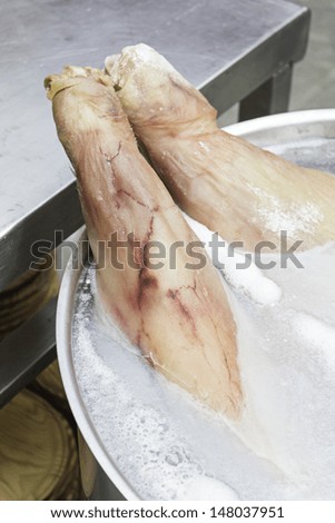 Leg simmering salted ham in feed market, food and cooking