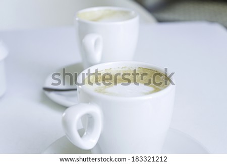 Coffee with milk in ceramic cup, bar and catering