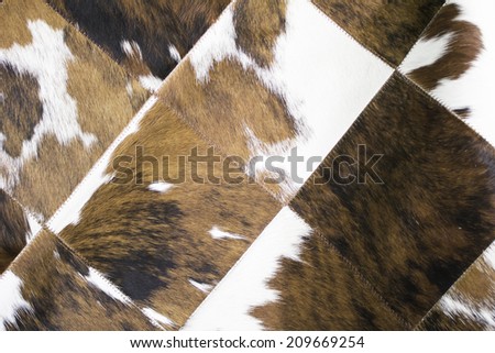 Brown and white animal fur blanket, fur