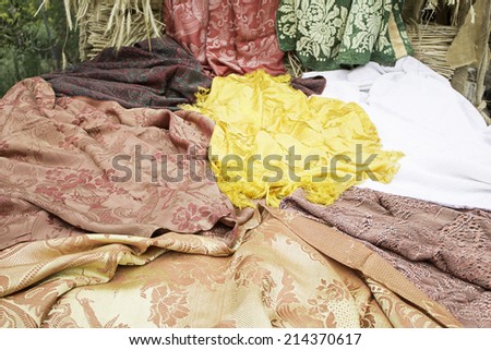 Embroidered tablecloths and fabrics in clothing store, decoration