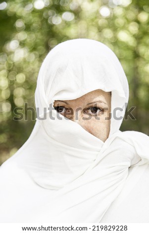 Moroccan Girl with veil in the head and cloth