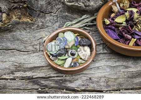 Plate with dry leaves and scented colors