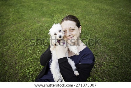 Girl with Dog hugging, animals and love