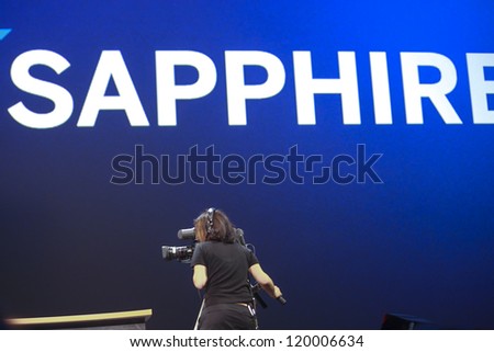 MADRID, SPAIN, NOV 13, 2012 - TV camera operator makes  live television coverage at Sapphire Now and TechEd conference in  Feria De Madrid  center on Nov 13, 2012 in Madrid, Spain