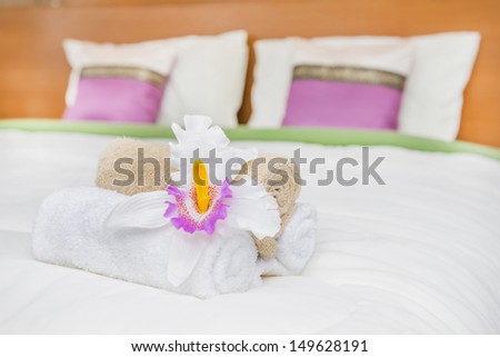 welcome towel on bed