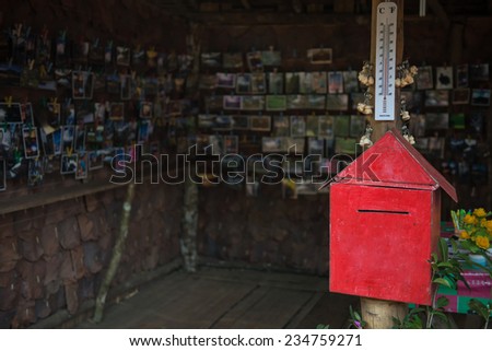 red mail box and postcard