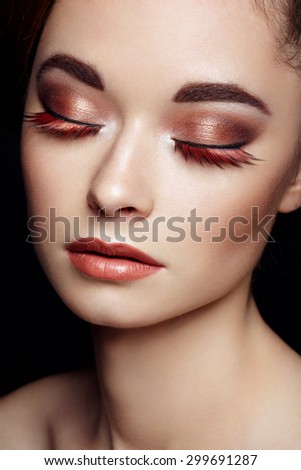 Beautiful woman face. Perfect makeup. Beauty fashion. Eyelashes. Cosmetic Eyeshadow. Elegant hairstyle