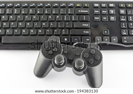 keyboard computer and game controller on a white background