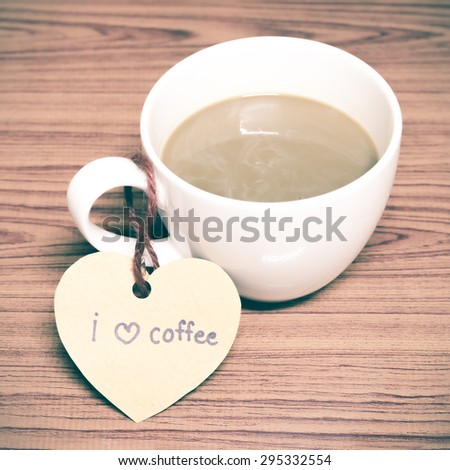 coffee cup with heart tag write I love coffee word on wood background vintage style