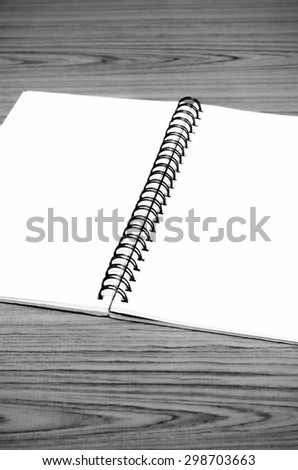 notebook line on wood background black and white color tone style