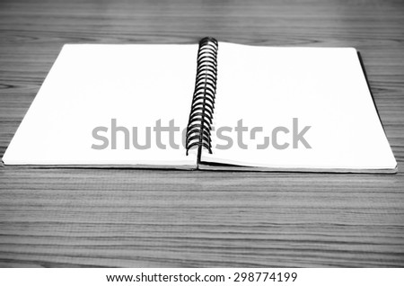 notebook line on wood background black and white color tone style