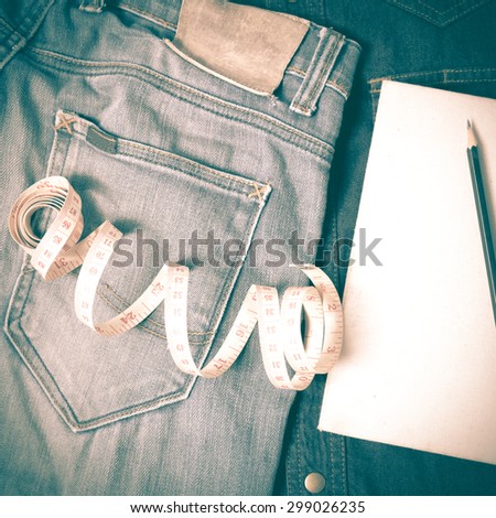 measuring tape and notebook with jean retro vintage style