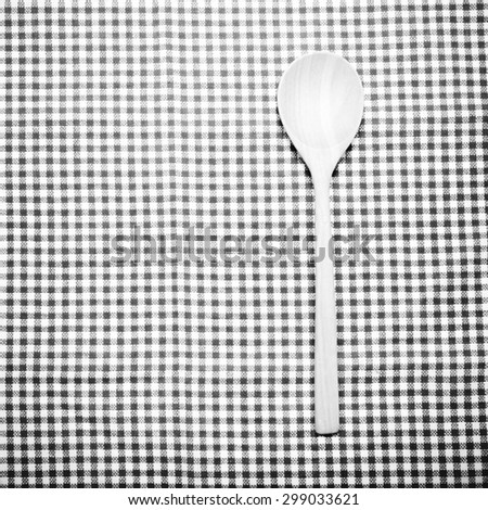 wood spoon on kitchen towel background black and white color tone style