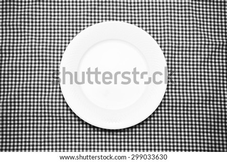 empty dish on kitchen towel background black and white color tone style