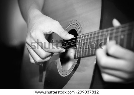 still life man playing guitar close up black and white color tone style