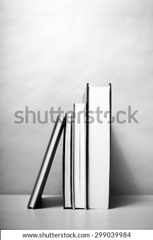 stand up of book on wood table background black and white color tone style