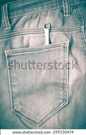 screwdriver in jean pocket pants retro vintage style