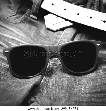 sunglasses on jean pants black and white tone color style