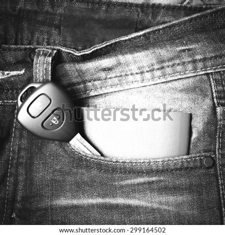 passport in jean pocket with car key black and white tone color style
