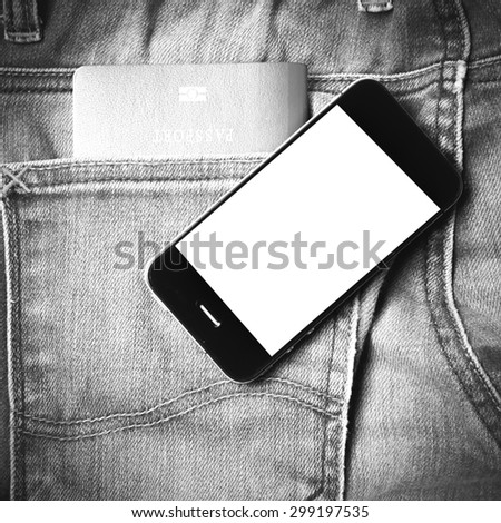 passport in jean pocket with smart phone black and white tone color style