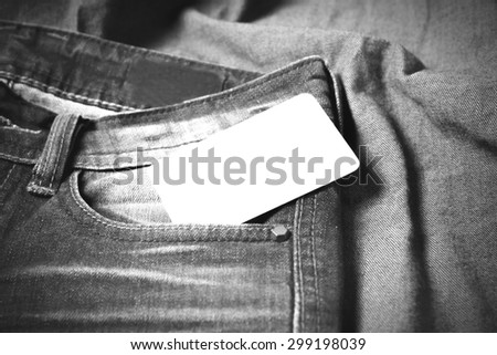 business card in jean pocket pants black and white tone color style