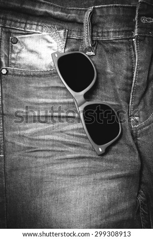 sunglasses on jean pants black and white tone color style