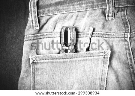 screwdriver in jean pocket pants black and white tone color style