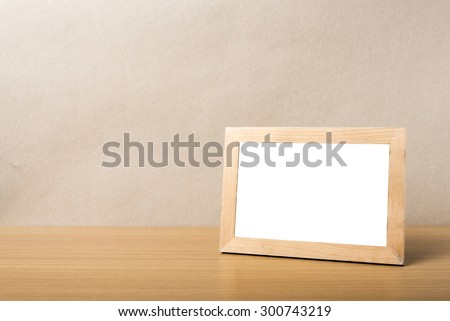 picture frame on wood table background