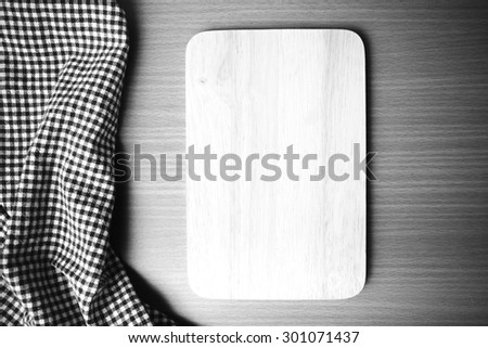 cutting board and kitchen towel on table black and white color tone style