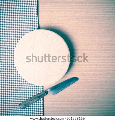 knife and cutting board on table vintage style