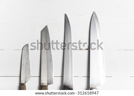 kitchen knife over white table background