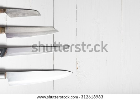 kitchen knife over white table background