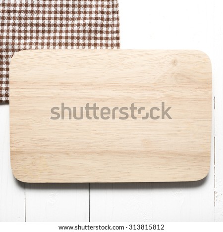 kitchen cutting board over white table background