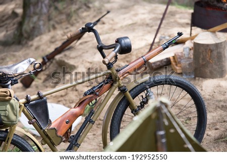 second world war bike with rifle