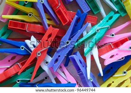 Pile of clothes pegs of different colors
