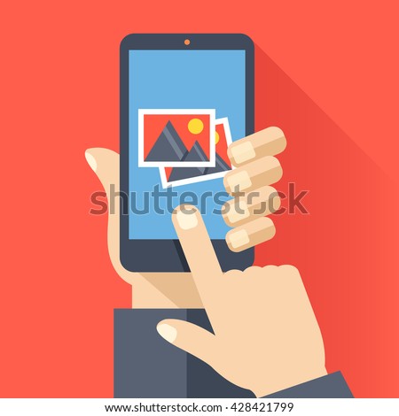 Hand holds smartphone with photos icon on smartphone screen. Multimedia, photo album app concept. Modern simple flat design for web banners, web site, infographics. Creative vector illustration