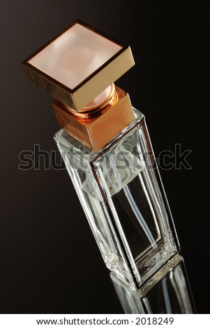White bottle perfume on black background