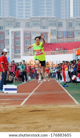 Xingtai City, Hebei Province - China, June 1: Held on June 1, 2012 in Xingtai, China University Games, a female athlete in the triple jump worked hard.
