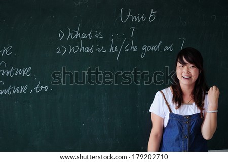 XINGTAI CITY, HEBEI PROVINCE, CHINA - JULY 14, 2011, July 2011:  In the July 14, 2011, in China Xingtai City, a school, an unidentified female teacher in English class. This is a fun English lessons.
